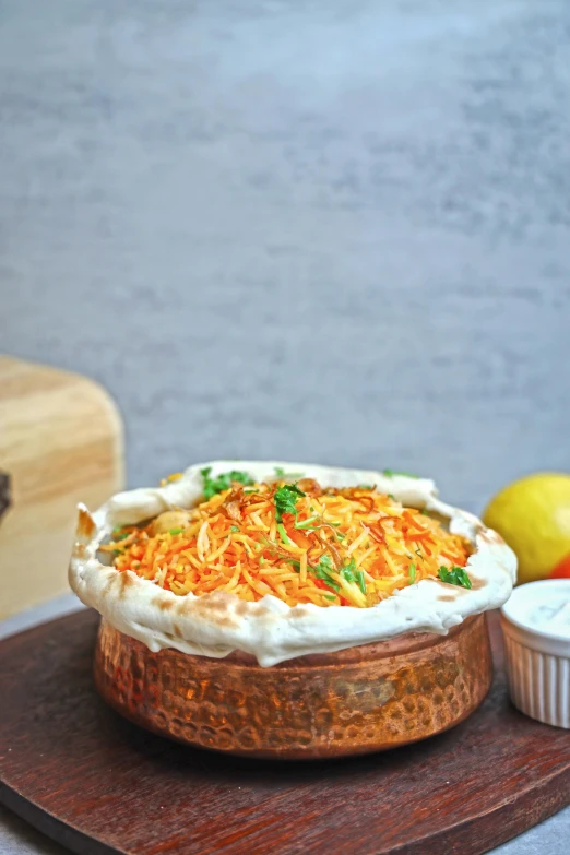 a close up of food on a table next to a bowl