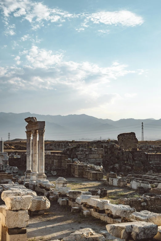 ancient ruins of buildings in ruins and vegetation on an open field