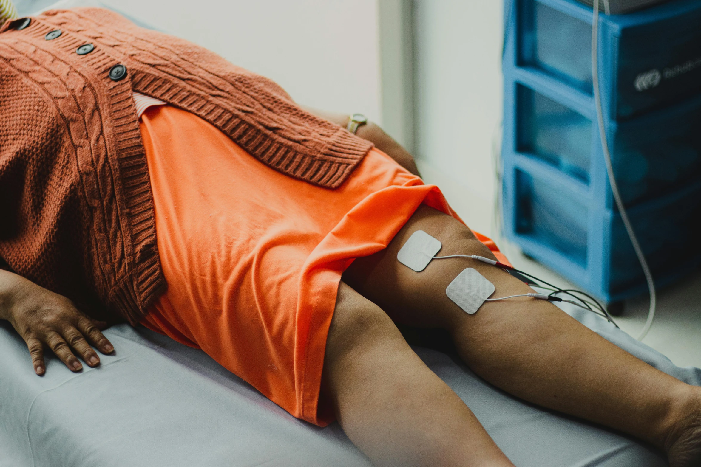 a young person laying in a hospital bed with an iv