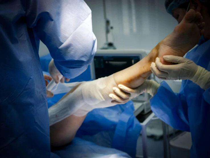 two surgeons are performing  on an operation