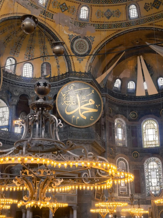 ornate ceiling with chandelier and lights in a cathedral