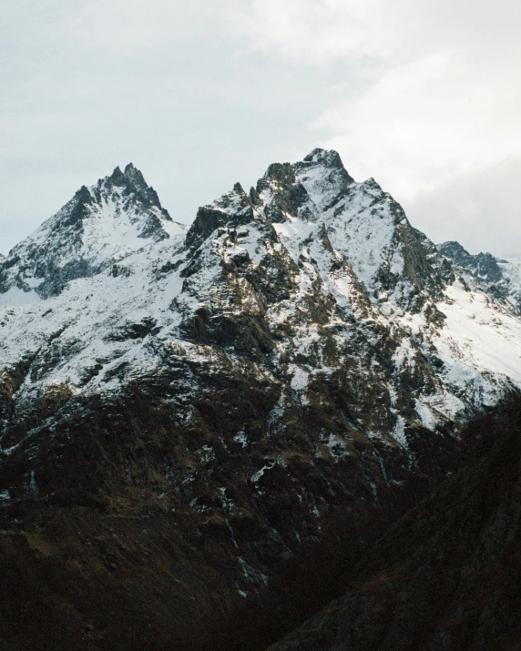 a view of a large mountain covered in snow