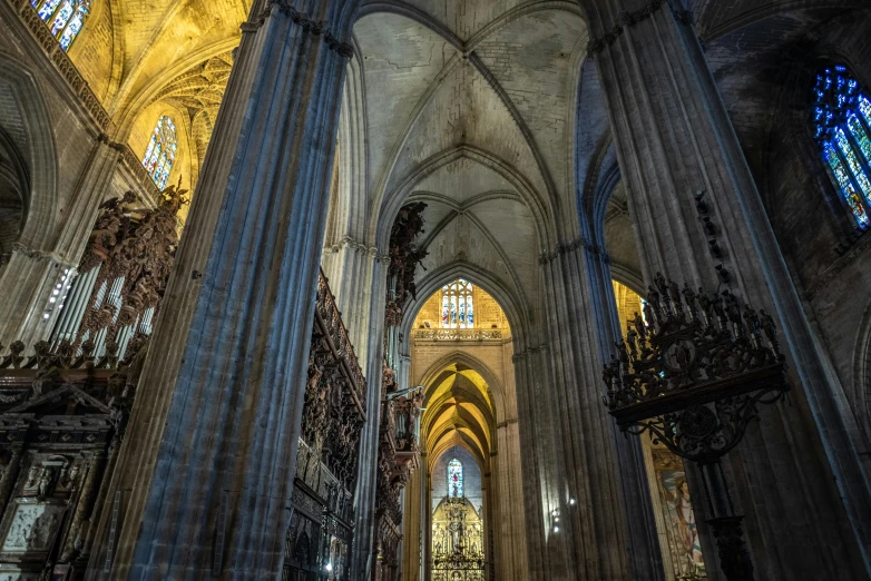 the interior of a cathedral with stained glass windows