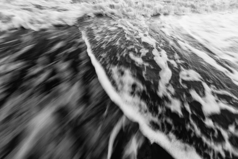 a surfboarder with a board in the water