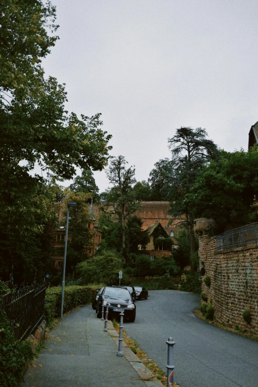 a street filled with lots of traffic next to trees