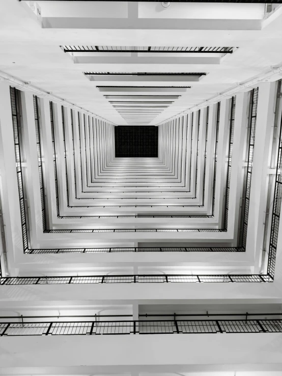 an empty hallway with rows and bars