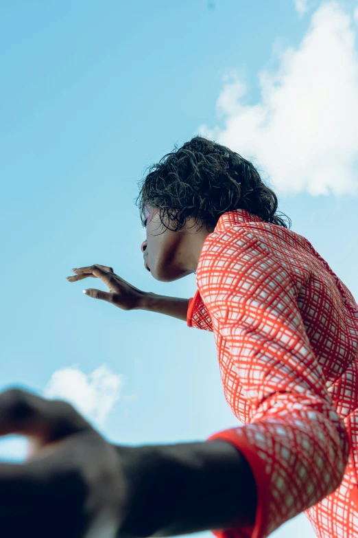 a woman that is throwing a frisbee in the air