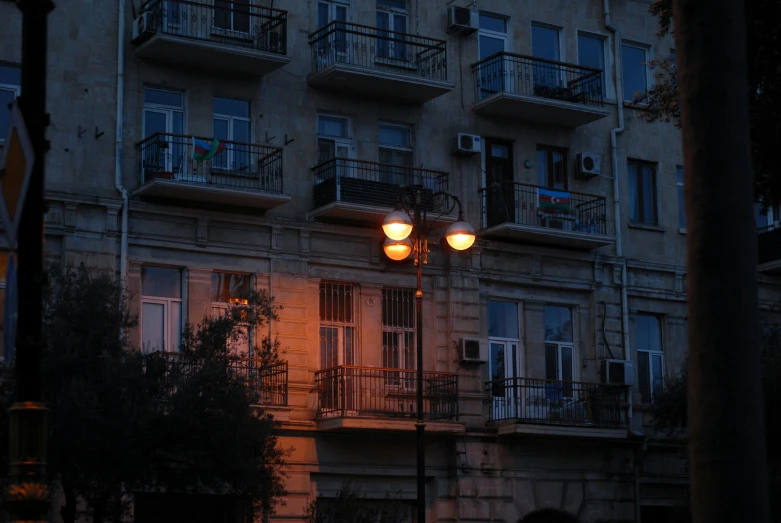 two street lights in the middle of a city