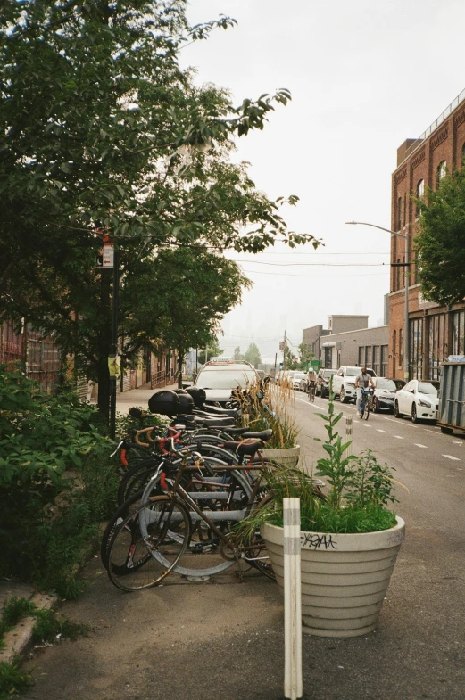 a city street with a bunch of bicycles parked