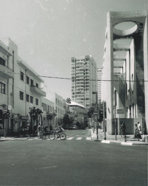 a busy street in a city with tall buildings