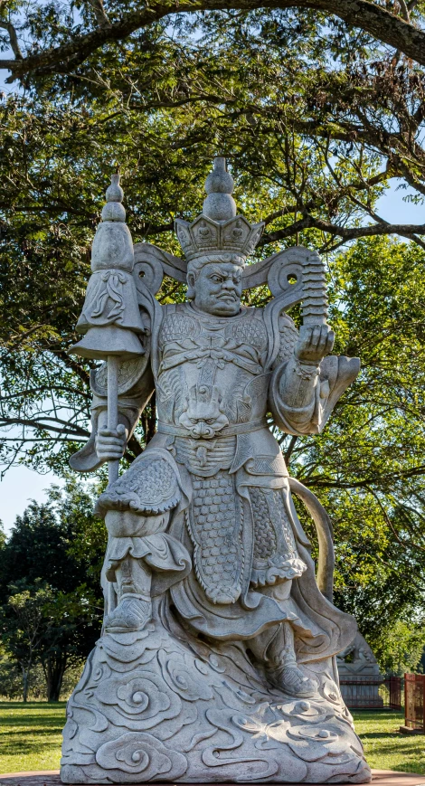 there is a statue on display in a park