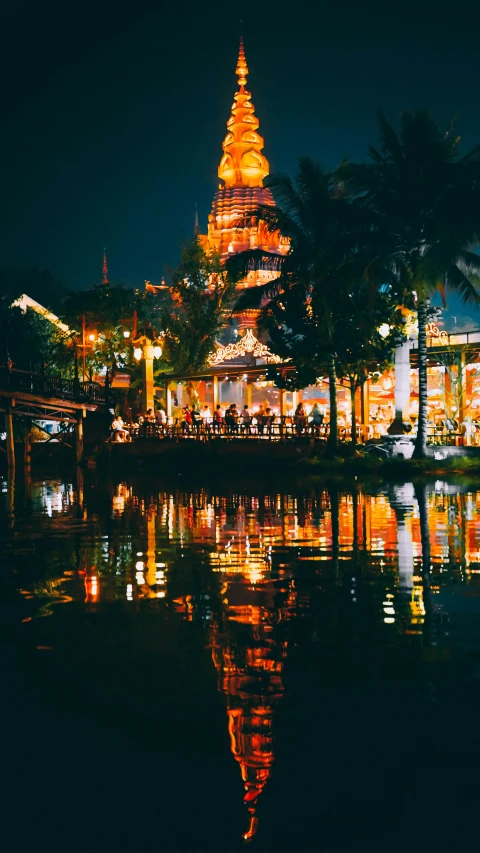 a reflection in the water of a building