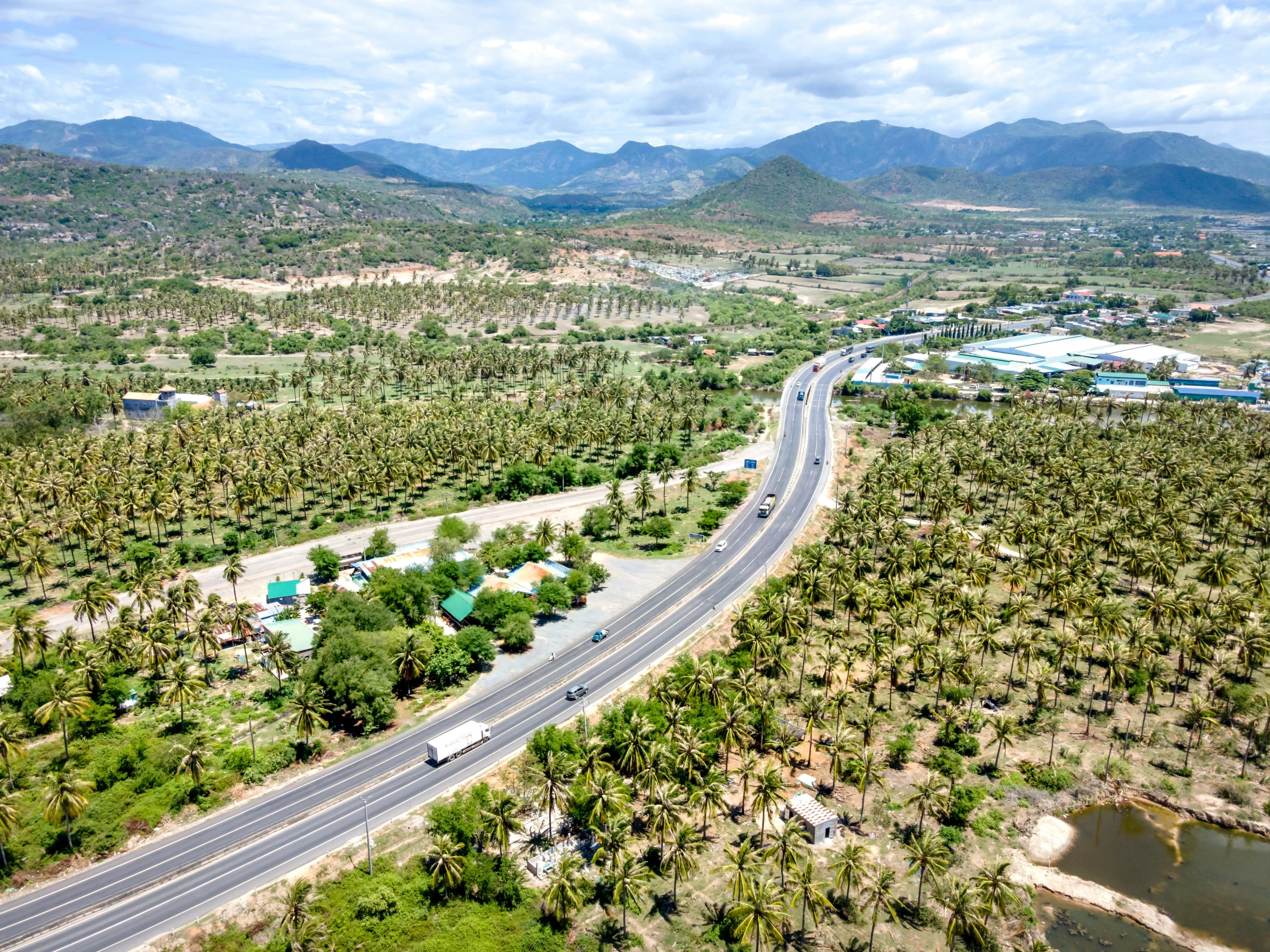 a highway with a lot of road lined in trees