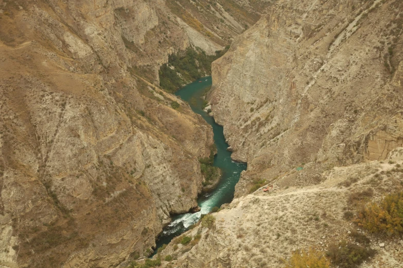 water running through an arid, narrow valley