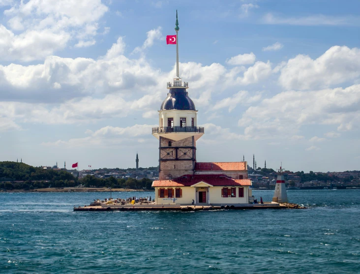 a tower of a light house built into the water