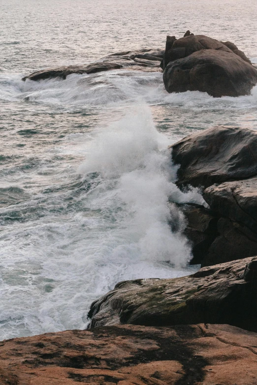 a couple of rocks that are in the water