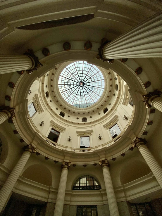 a very beautiful looking room with pillars around it