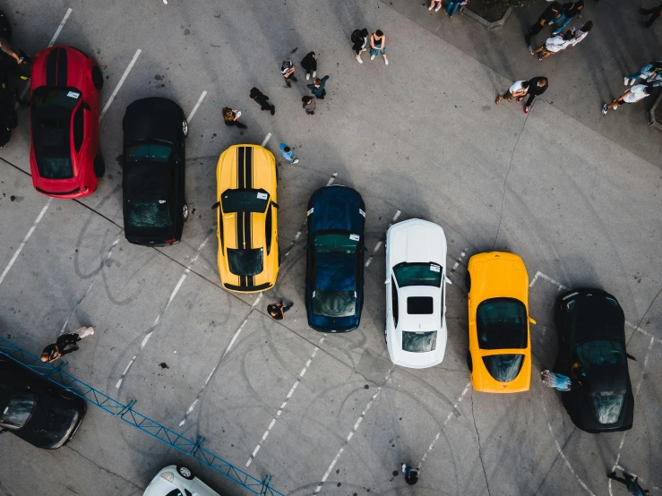 several sports cars parked next to each other