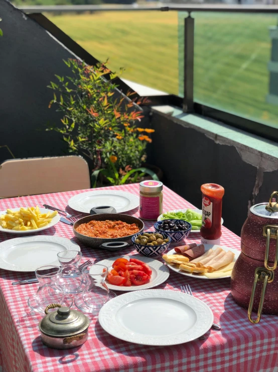 a plate of food and water bottles on a table