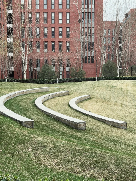 stone sculptures in the city park near a building