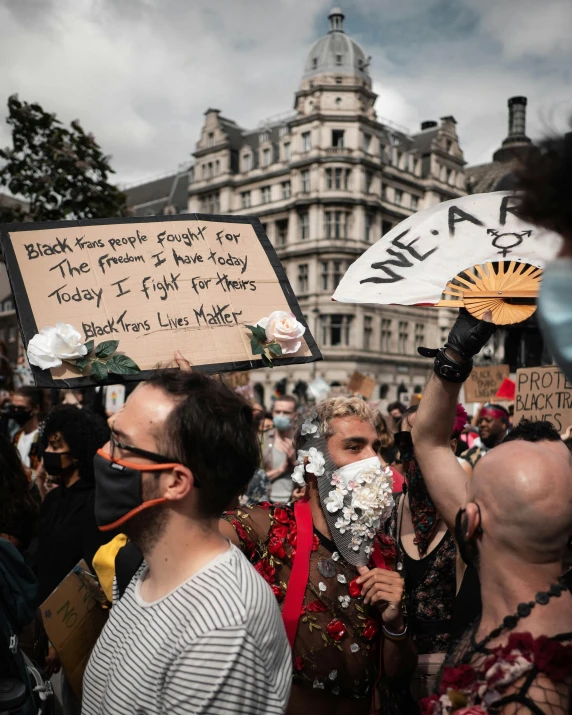 group of people on the street protesting against racism