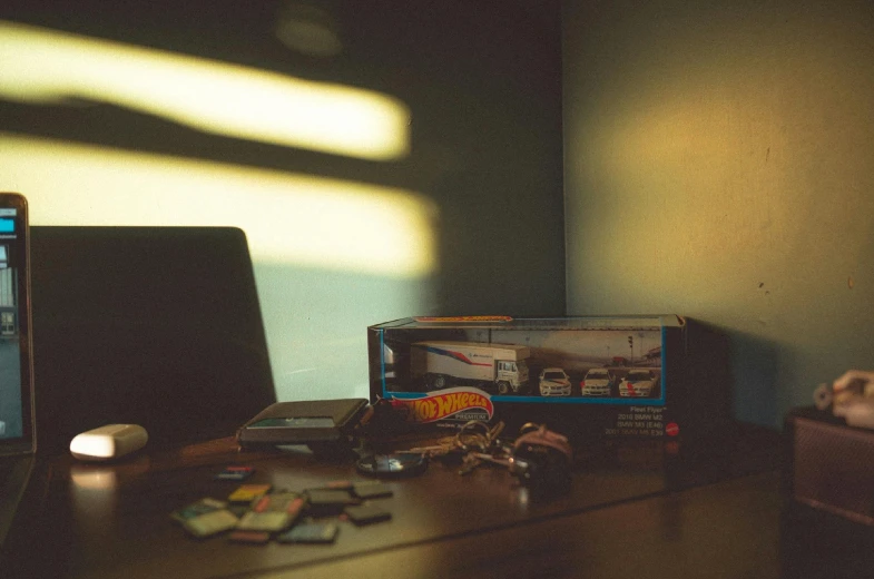 an open laptop computer sitting on top of a wooden desk