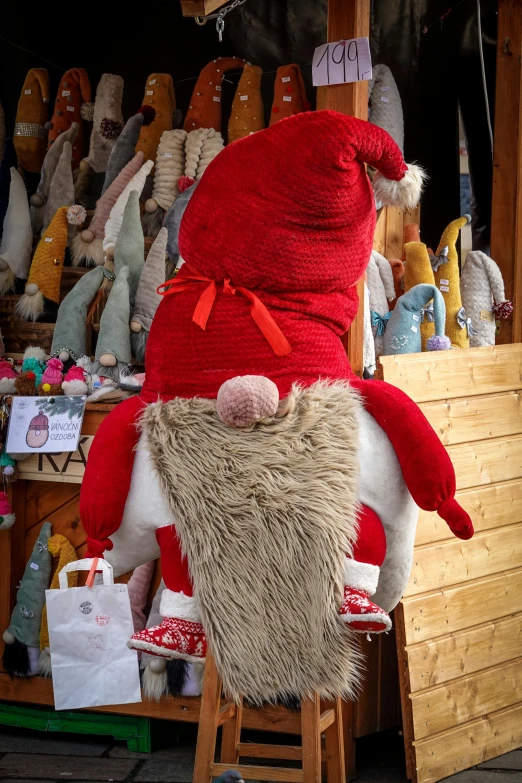 a large assortment of stuffed animals that are on a chair