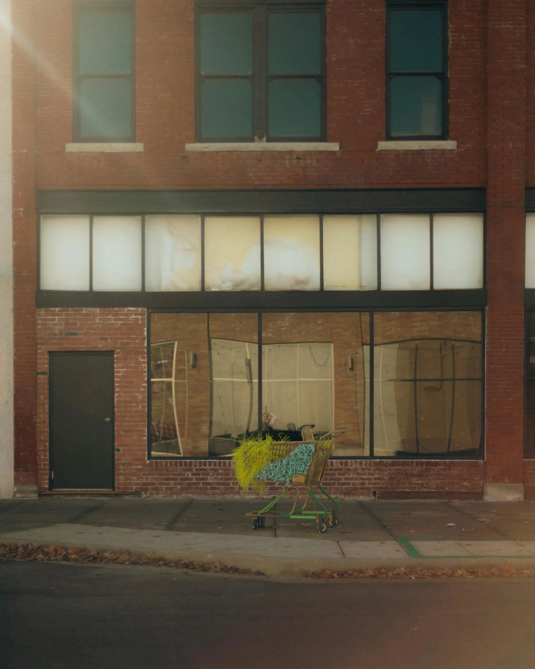 a storefront with a bench in front of it