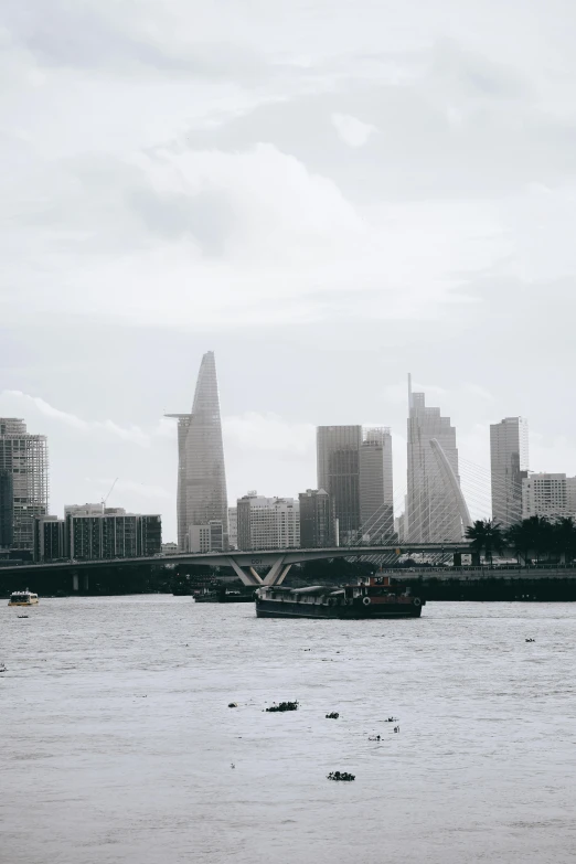 a large body of water sitting under a cityscape