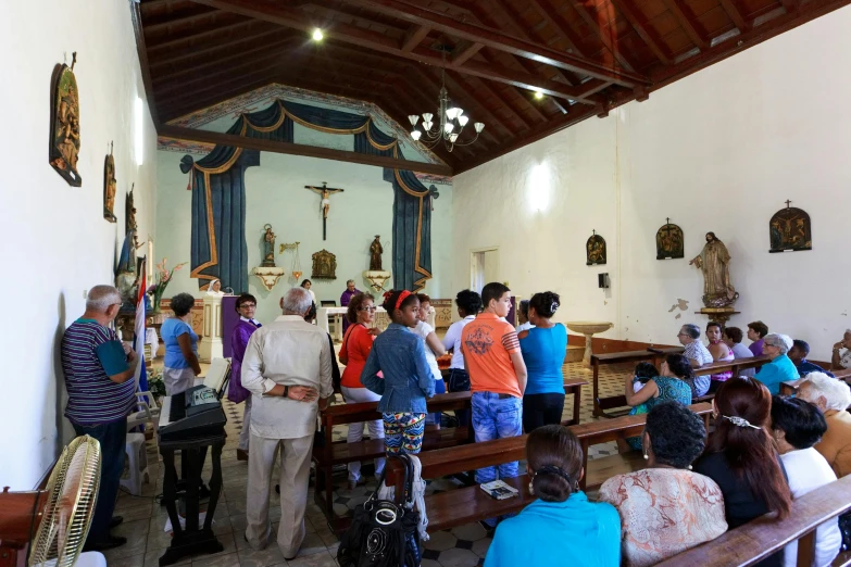 the crowd is waiting in the church for the service to begin