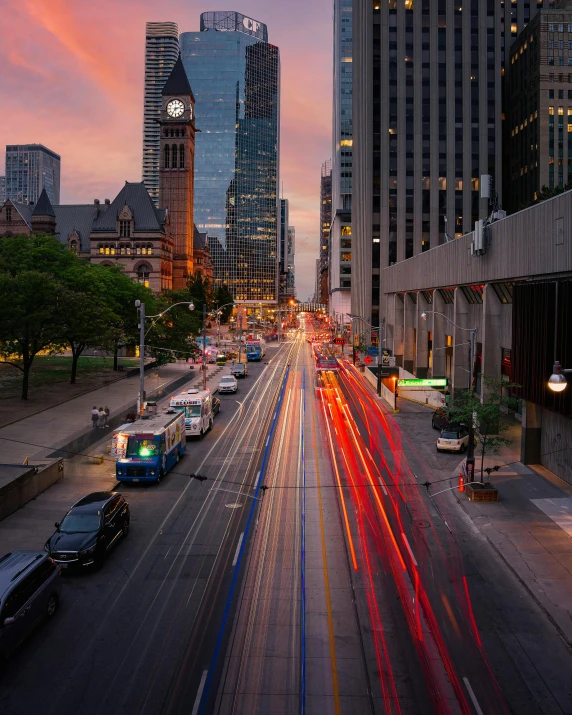 a very busy city street with some very tall buildings