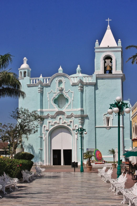 a blue building with a large white doorway