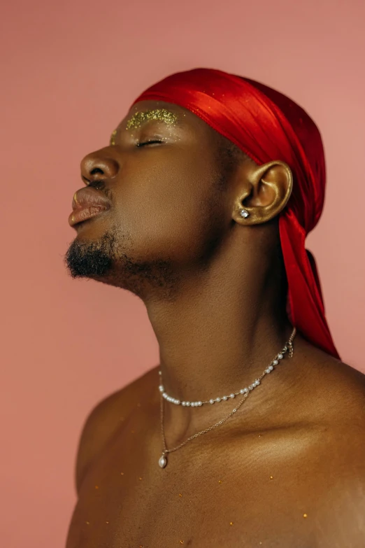 an afro american male in his red bandana