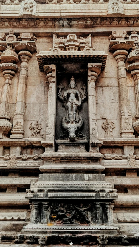 large, ornate stone structure with elaborate carvings on top