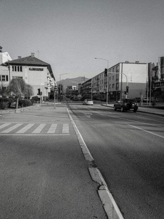 a black and white po of a road and houses