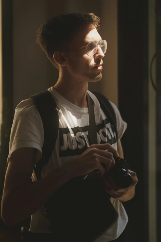 a man with a backpack looking at soing off camera