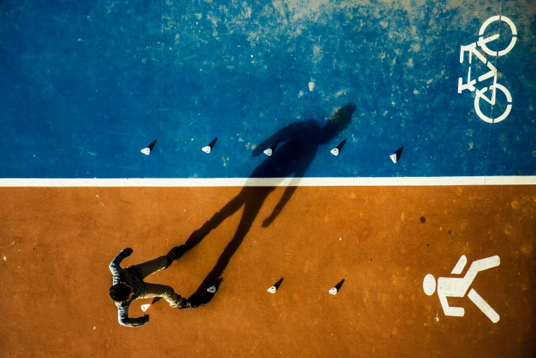 a person standing on the tennis court playing tennis