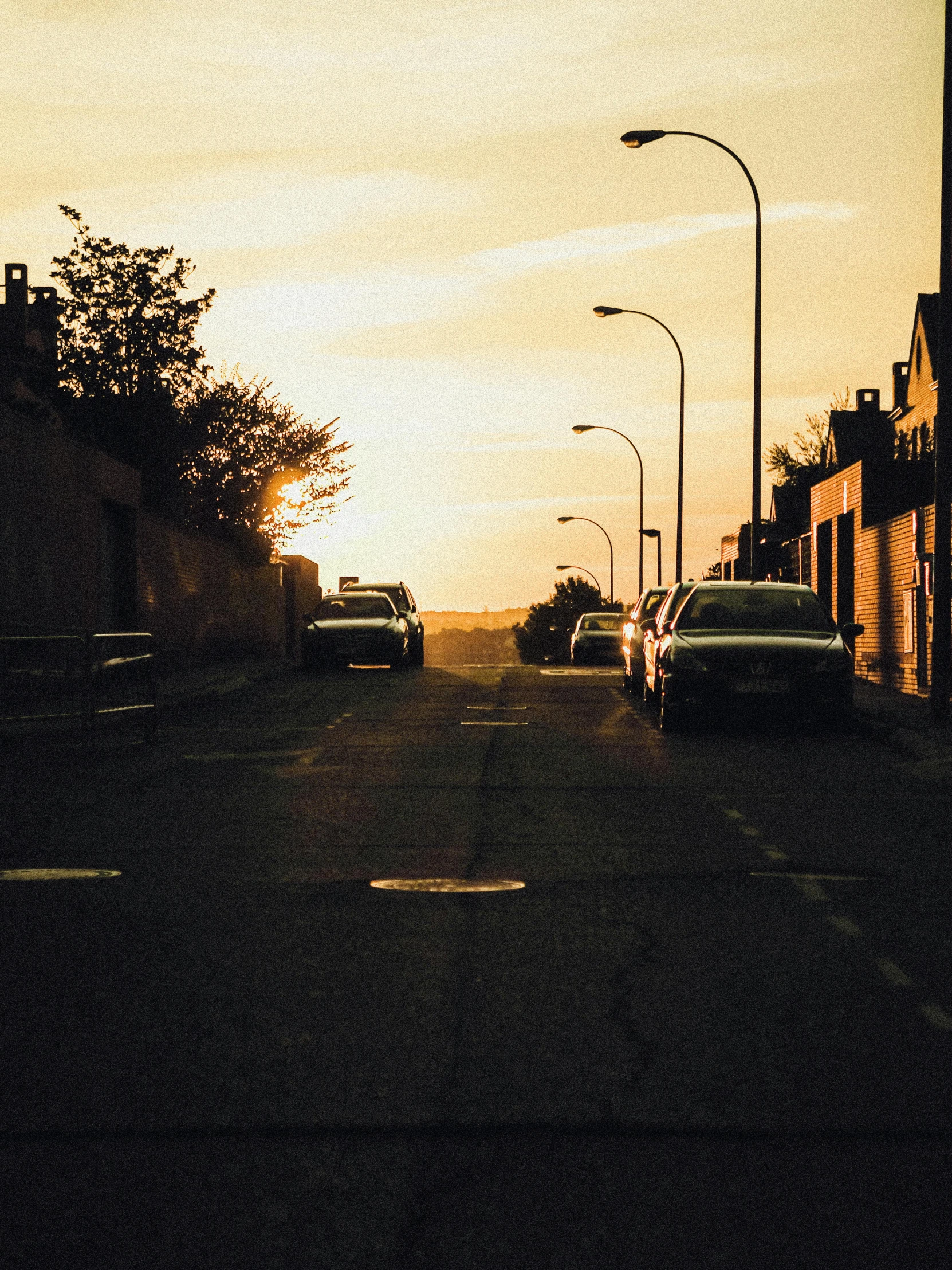 a street with cars parked along the side