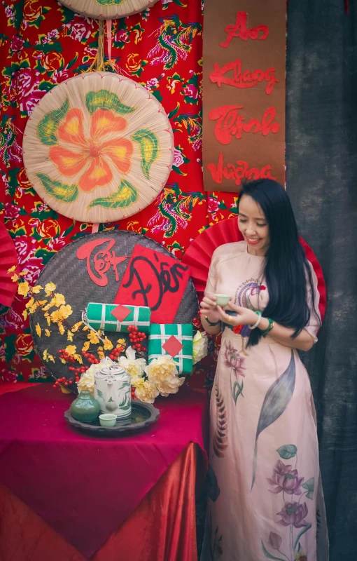 woman in an oriental dress looking at her phone