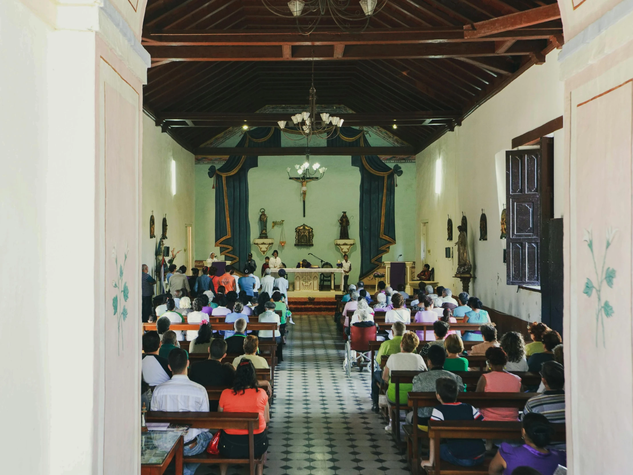 a church with people sitting at their desks