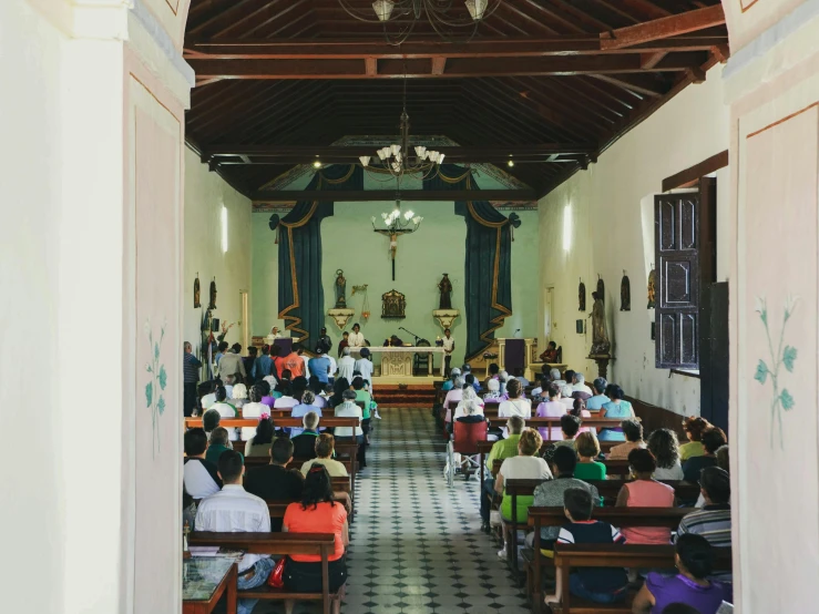 a church with people sitting at their desks