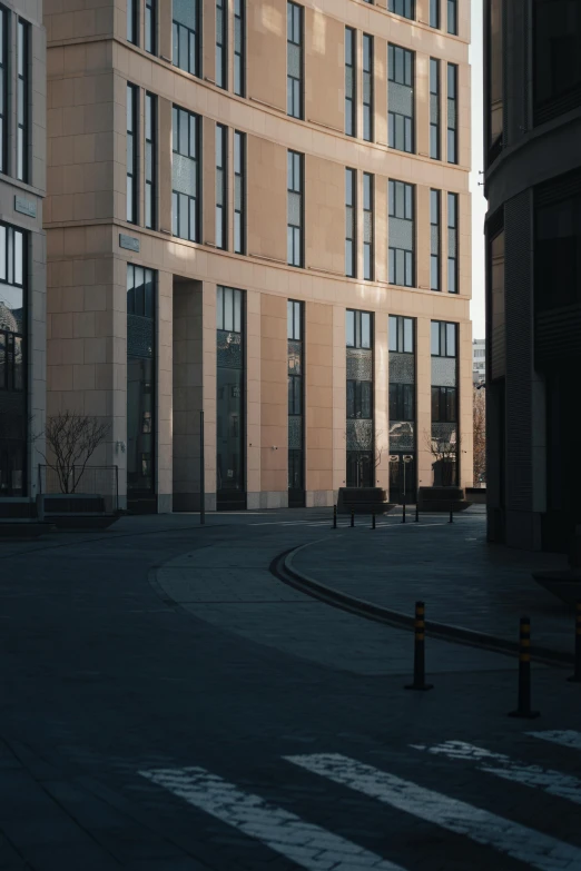 an empty area near a building with several windows