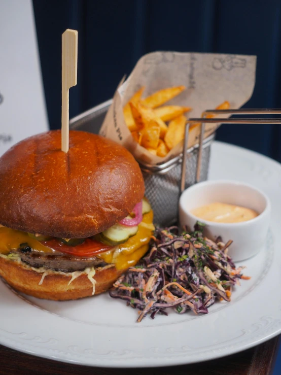 a sandwich and some fries are on a white plate