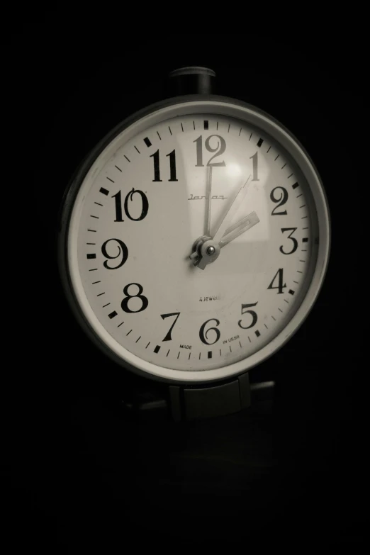 a close up of a clock on the floor