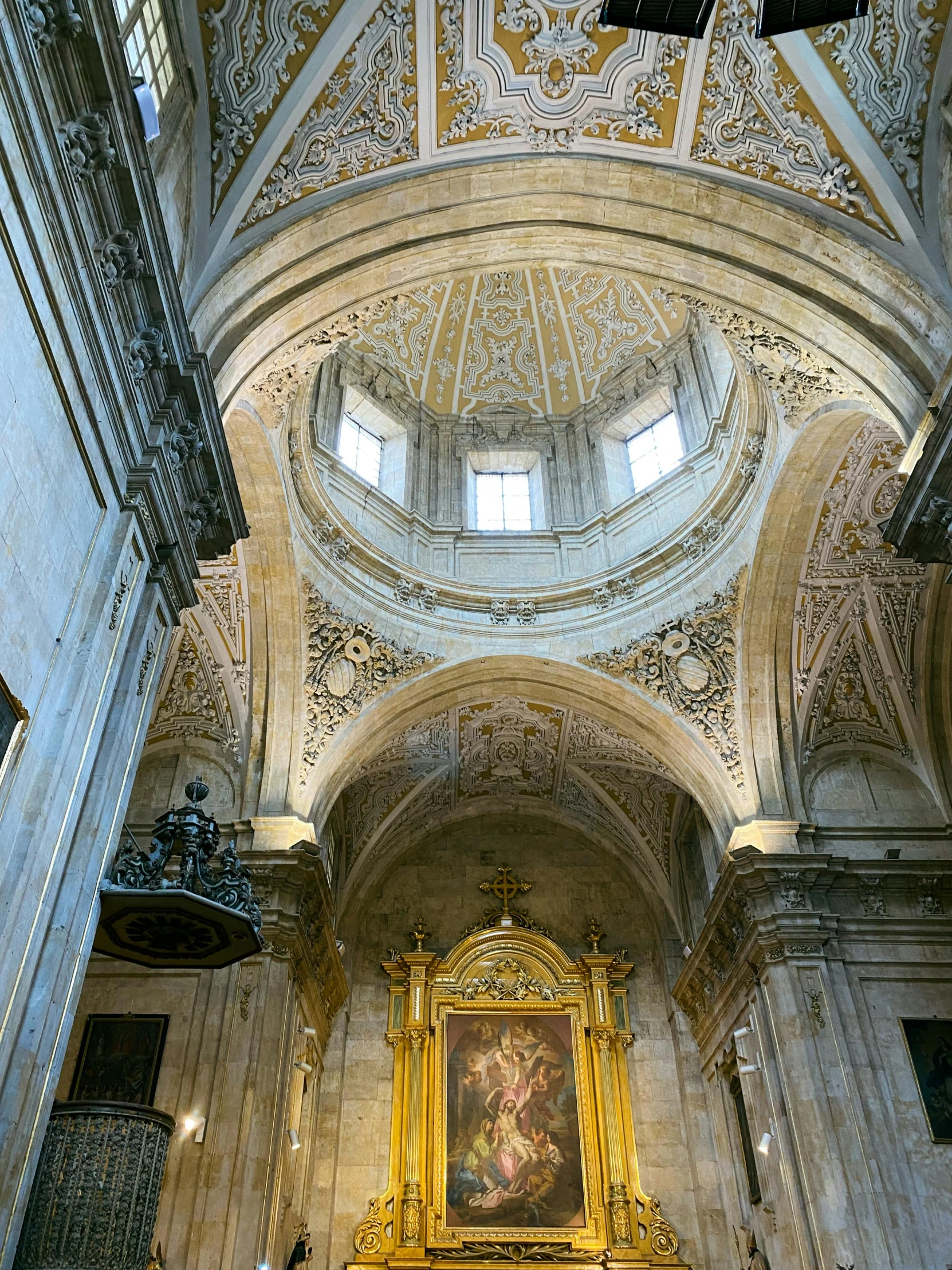 a fancy golden statue sitting inside of a church