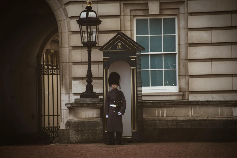a policeman standing on a step next to a doorway