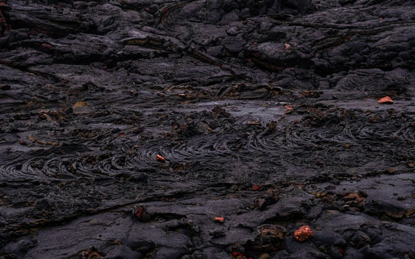 a black lava filled with water and rocks