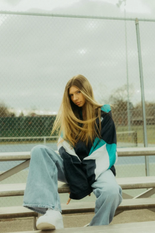 a person sitting on a bench with a skateboard