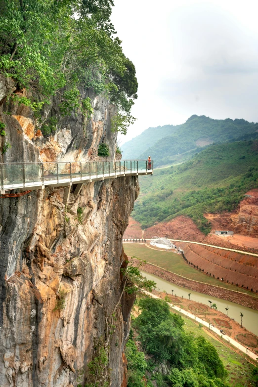 an empty walkway sits on the edge of a cliff