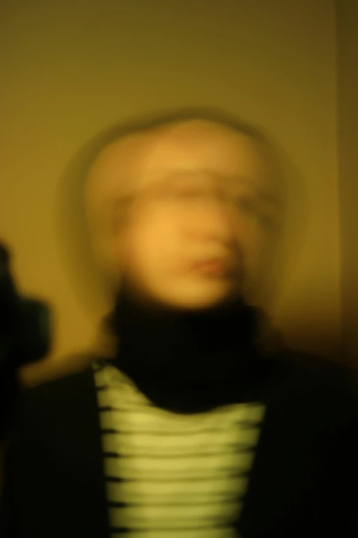 a blurry pograph of someone's face is shown